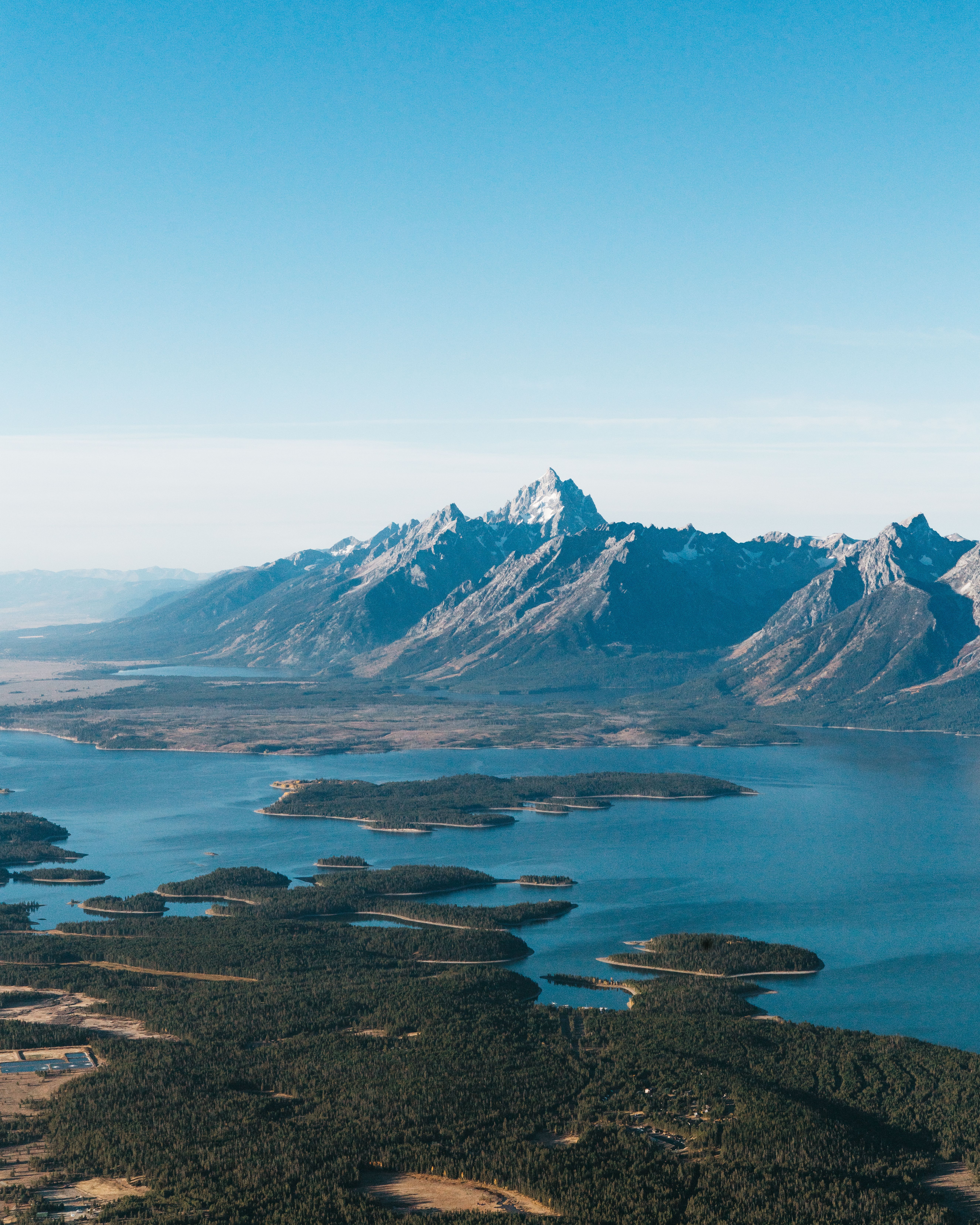 The peaks of the Teton range rising above the valley